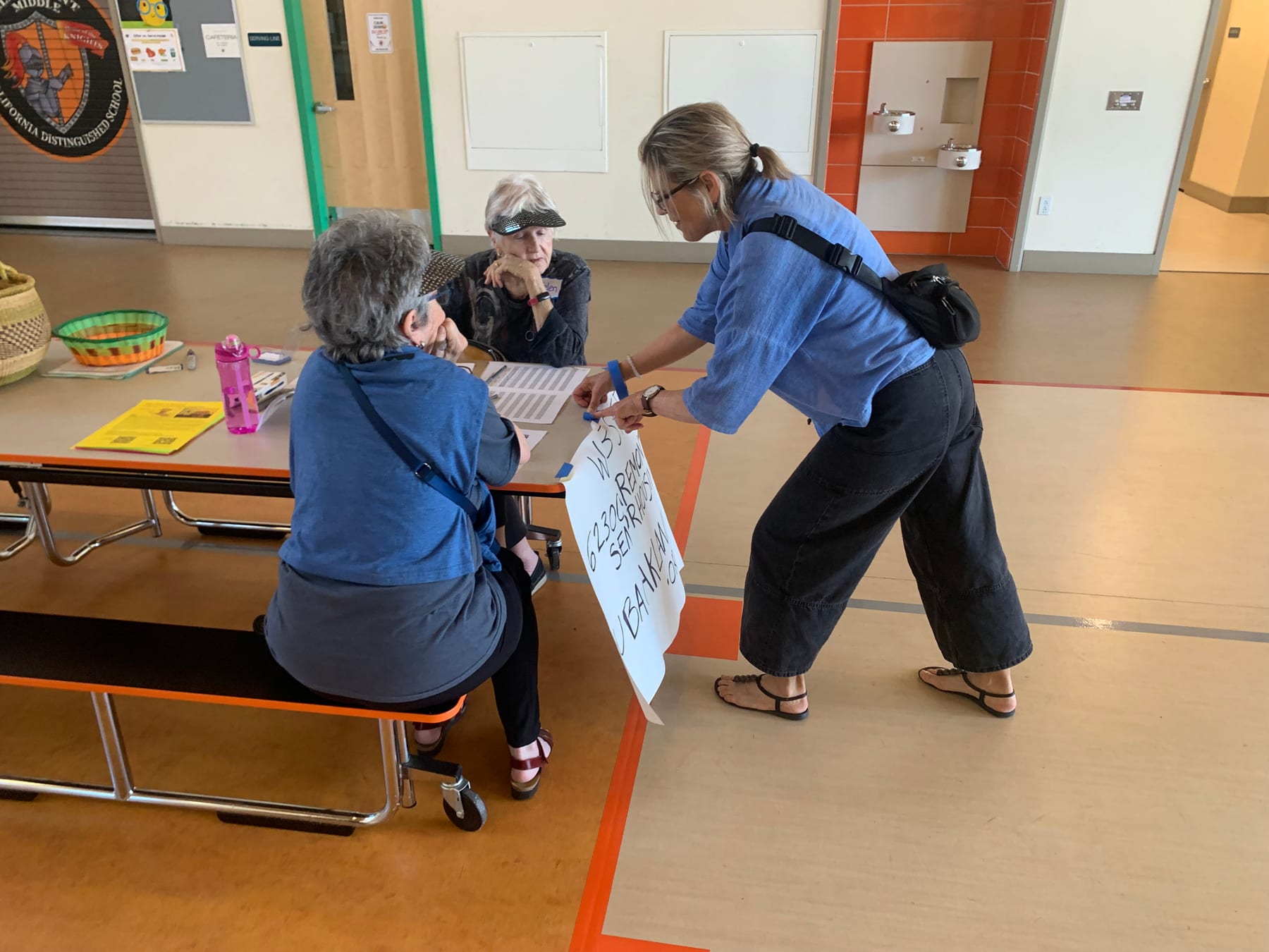 Abby and Helen with Tori Griffith of RNSH at the June 13 community meeting.